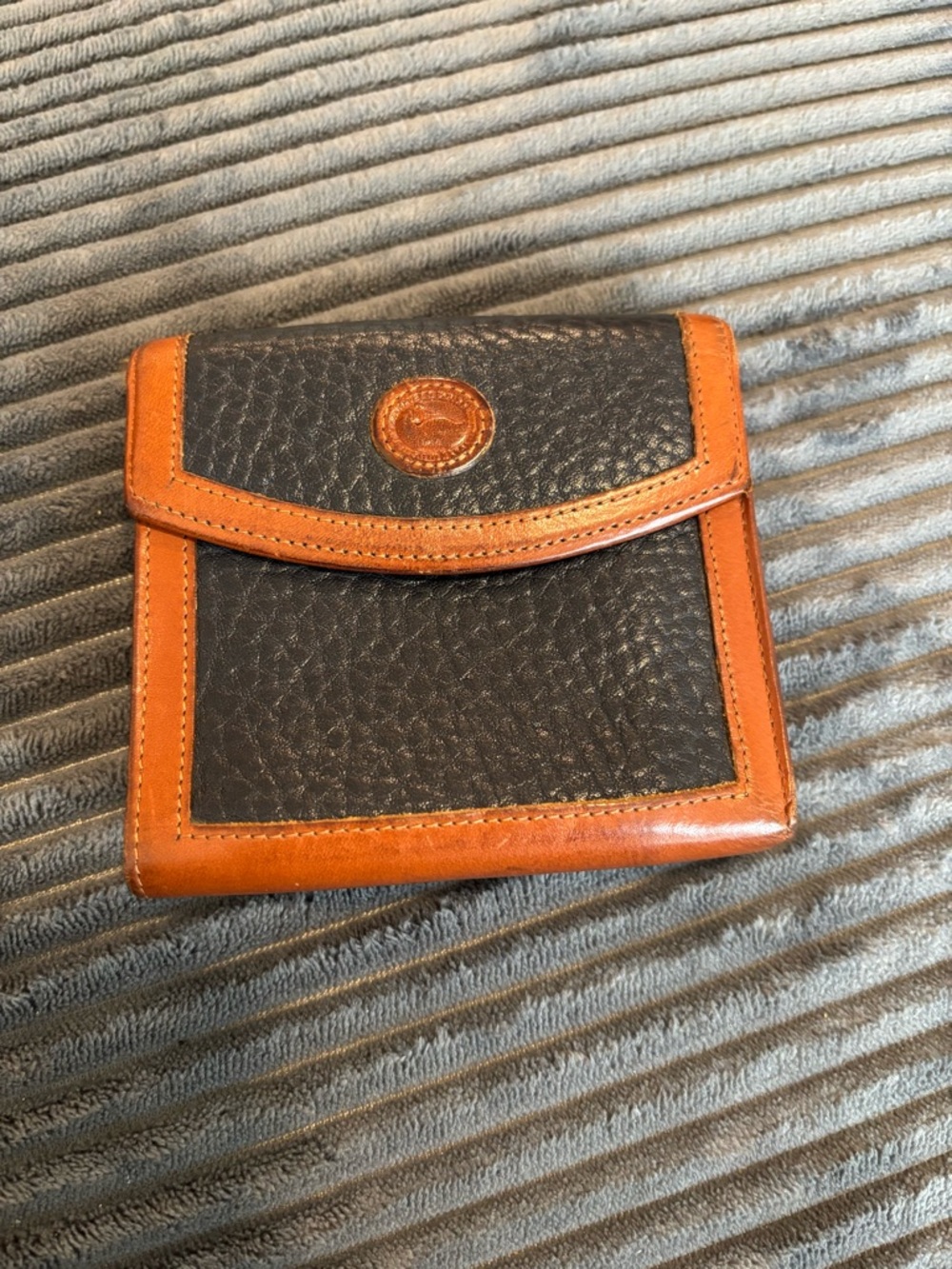 Dooney & Bourke Two-Tone Leather Bifold Wallet with Medallion Accent